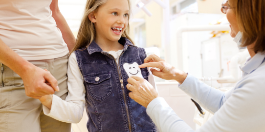 Family dentist in Acton at Dentistry On Sinclair examining child's teeth during first visit